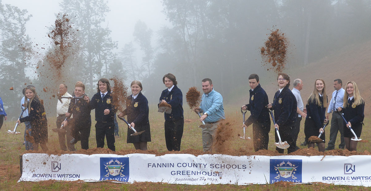 The real winners of the new greenhouse being constructed next to the Fannin County School System Agriculture Facility are the students and staff who will put it to use. Some of those individuals staged their own impromptu groundbreaking after the official ceremony last week. Taking part were, from left, Fannin County High School FFA officers Sarah Brawley, Dakoda Moore, Chase DeMar, Samantha Adkins, Brady Coleman, FFA Advisor Seth Davis, Jacob Williams, Roy Green, Abigail McFarland, and Kaleighann Ware.
