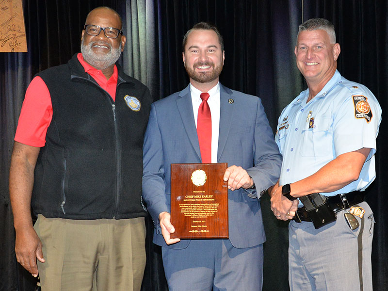 McCaysville Police Chief Michael Earley, center, was presented a special award for his work with the Governor’s Office of Highway Safety (GOHS). Allen Poole, left, director of GOHS, and Major Doug Wilson of the Georgia State Patrol presented the award.