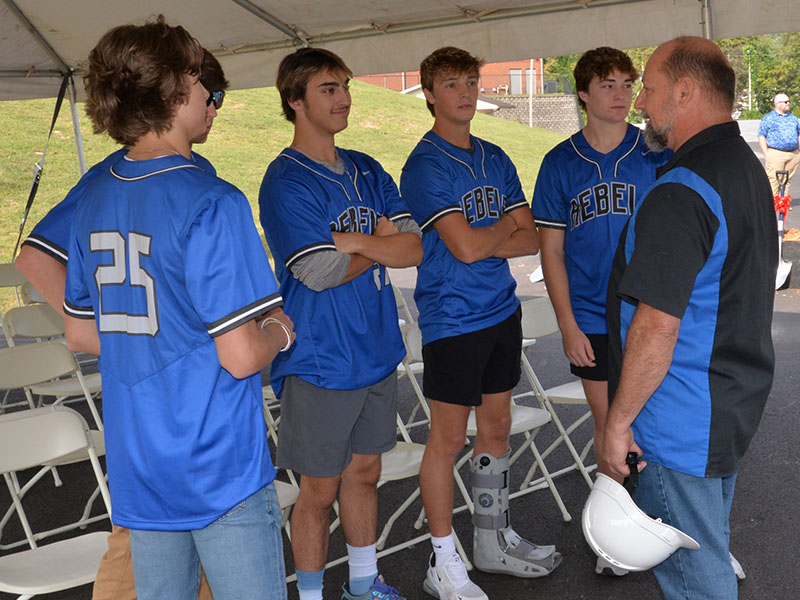 Fannin County school board Vice Chairman Mike Cole, right, hears what Fannin County Rebel baseball players have to say about the new facilities. Shown with Cole are, from left, Carter Fox, Christian Beavers (hidden behind Carter), Gaige Foster, Bryce Burnette, and Cole Stevenson.