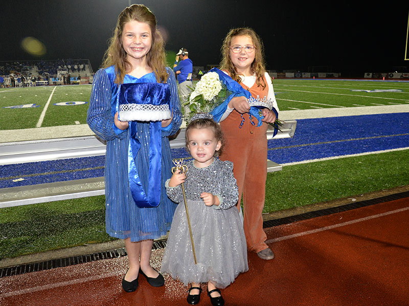 Layla Grimes, Jameson Rogers and Ryleigh Callihan, from left, stand ready to crown Fannin County High School’s homecoming king and queen.