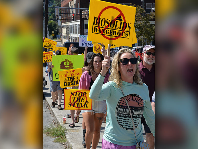 Protesters make their way up Grande Avenue toward City Hall in Copperhill last Wednesday. They expressed their concerns over the odor omitted from biosolids being spread at Copperhill Industries that are driving school students inside at Copper Basin schools, as well as possible effects on area water.