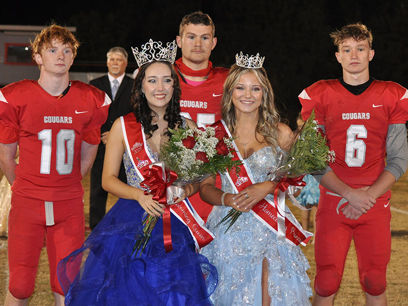 Maddie Cribbs (front left) was crowned homecoming queen and Kendra Deal homecoming princess by senior football players, back from left,  Kelle Shroth, Landon Allen, and Avery Crowder. The crowing concluded homecoming activities Friday night during halftime of the Copper Basin Cougars football game.