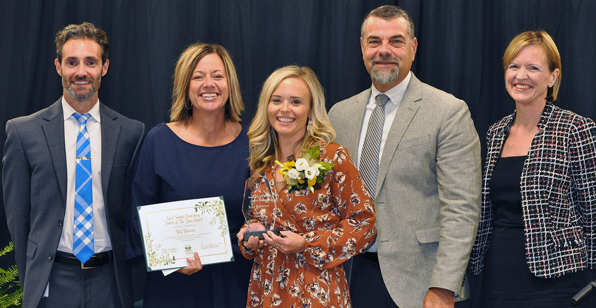Fannin County Teacher of the Year Katy Roberson, center, was recognized by her peers for the award, which was presented during an annual banquet at the Fannin County Agriculture Center. Shown following the announcement are, from left, Chief Academic Officer Dr. Lucas Roof, West Fannin Elementary School Principal Allison Danner, Katy Roberson, Chief Operations Officer Darren Danner, and School Superintendent Shannon Dillard-Miller.