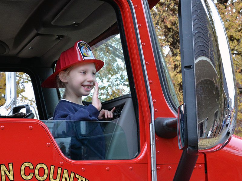 Kylee Hollins waved to parade watchers from a Fannin County fire engine.