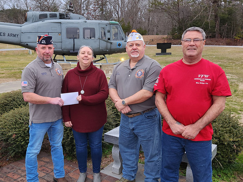 Harold Bargeron, commander of Blue Ridge Post 6570 of the Veterans of Foreign Wars, from left, is shown presenting a donation to Mandi Hyde of Fannin County Family Connection. Joining Bargeron were VFW members James Callender and Julian Black. Serving the community is one of the core values of the VFW.
