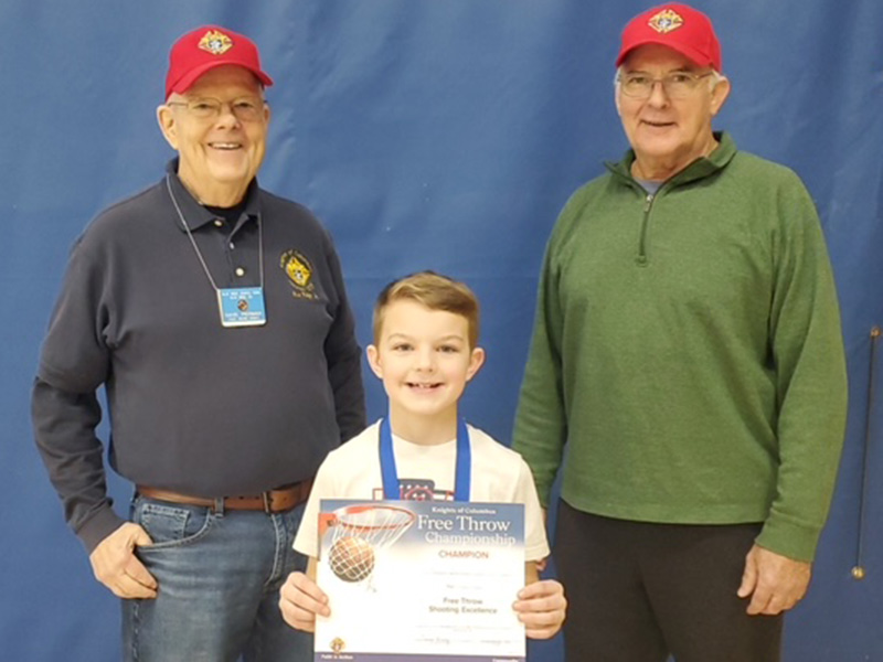 Tanner Jackson was the male winner for the nine year old group. He is shown with Dave Piermanleft, and Don Wirtz.