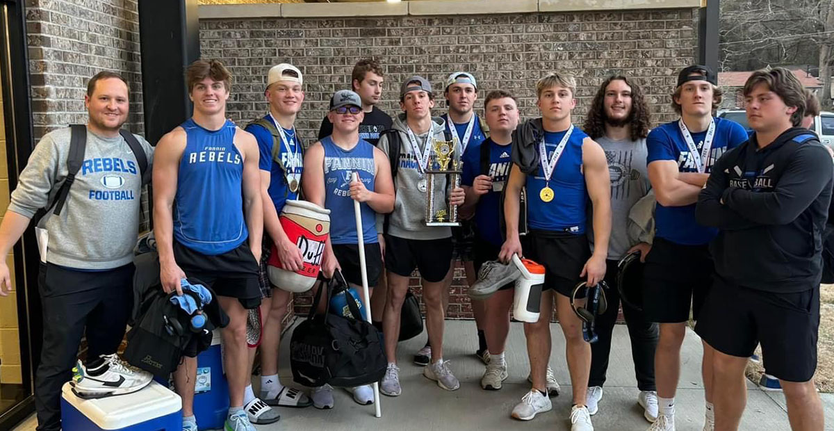 The FCHS Weightlifting team smiles  with their Runner-Up trophy after the state competition Saturday, March 2. Shown are, from left, Coach Wade Woodall, Lawson Sullivan, Cooper Born, Barron Davenport, Isaac Watkins, Braden Taylor, Case Holloway, Jacob Green, Carson Callihan, Jacob Dye, Bryson Cole and CJ. Reece.