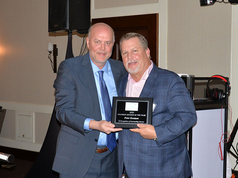 Peter Knutzen, right, was named the Member of the Year by the Fannin County Chamber of Commerce. He was presented his award by Chamber board member Doug Miracle during the organization’s annual banquet Saturday night.