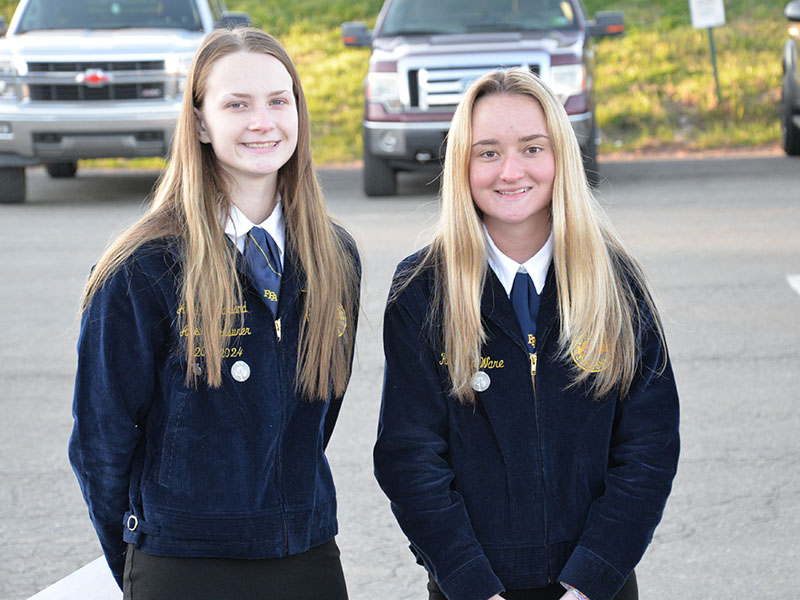 Fannin County FFA members Abby McFarland, left, and Kaleighann Ware read Paul Harvey’s So God Made a Farmer to conclude the first annual Seeds & Farms, Gardens, Fields & Herbs blessing at Mercier Orchards.