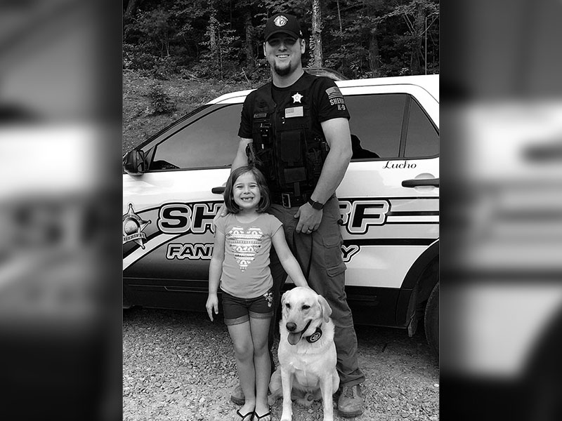 Dustin Carder and his daughter, Brintlie Carder, are shown with Dustin’s K9 partner, Lucho.