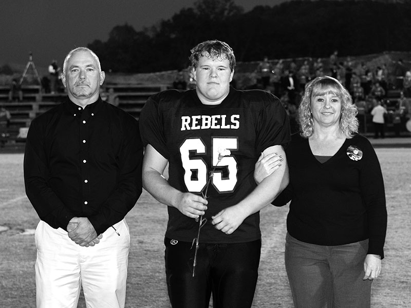 Standing on the field at Fannin High for senior night are, father, Jerry Daves, Geoffrey Daves and mother, Rhonda Daves.