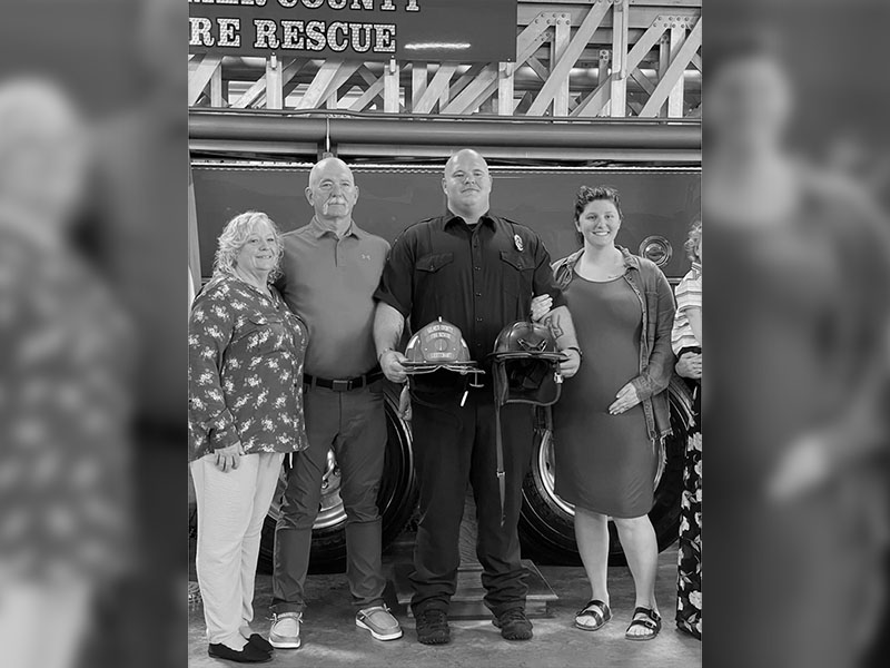 Geoffrey returned home after one season at Averitt to pursue his dream of becoming a professional firefighter. His family stands together supporting him, from left, mother, Rhonda Daves; father, Jerry Daves; Geoffrey Daves; wife, April Daves; and son, Payton Daves.