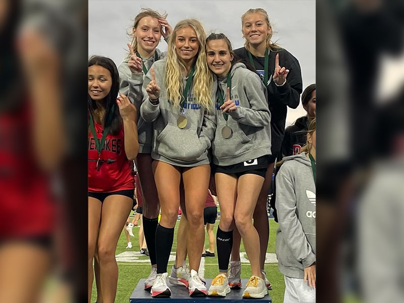 Fannin County High School’s 4x800 meter relay team of Lindsey Holloway, Ava Acker, Carlee Holloway and Karli Sams are shown on the podium after their first place finish at the Creek Invitational Meet.