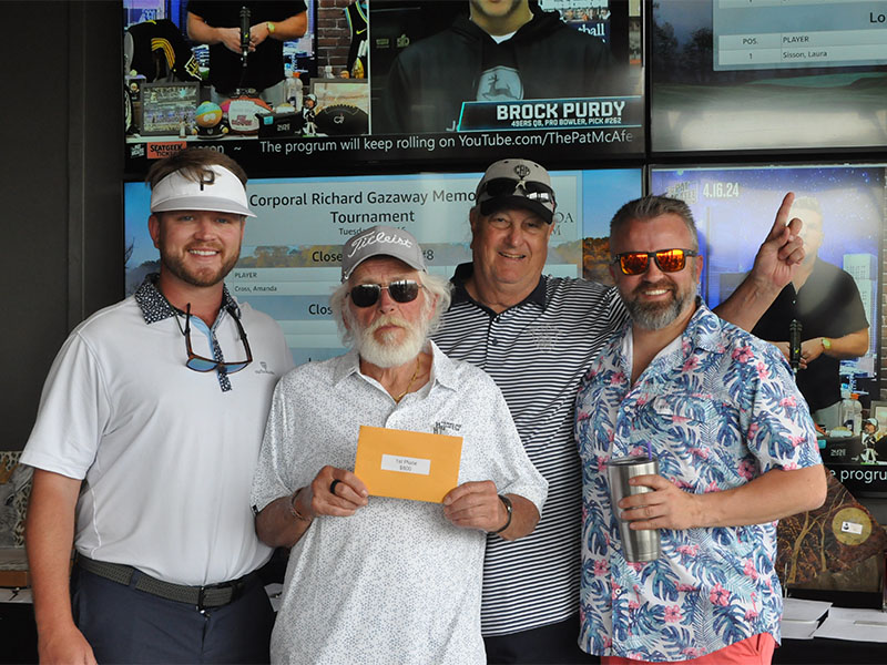 Mitchell Construction took first place in the Corporal Richard Gazaway Memorial Golf Tournament. Accepting the award are, from left, Taylor Cato, Brett Mitchell, Bob Martin, and Frank Mayer. 