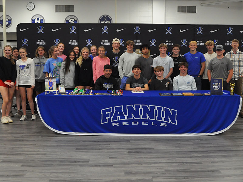 News Observer photos/Catrina McQuigg Members of Fannin County High School’s Track and Field teams gather to congratulate Zecharian Prater on his Letter of Intent signing.
