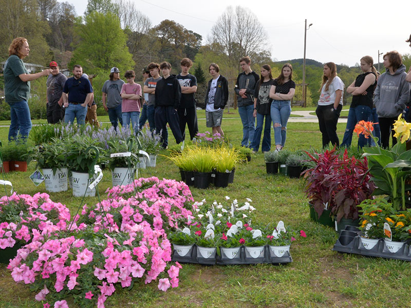 Ginger Montgomery, left, from Copper Basin High School helped lead Fannin and Basin students in designing flower beds at the Toccoa River Park in McCaysville.