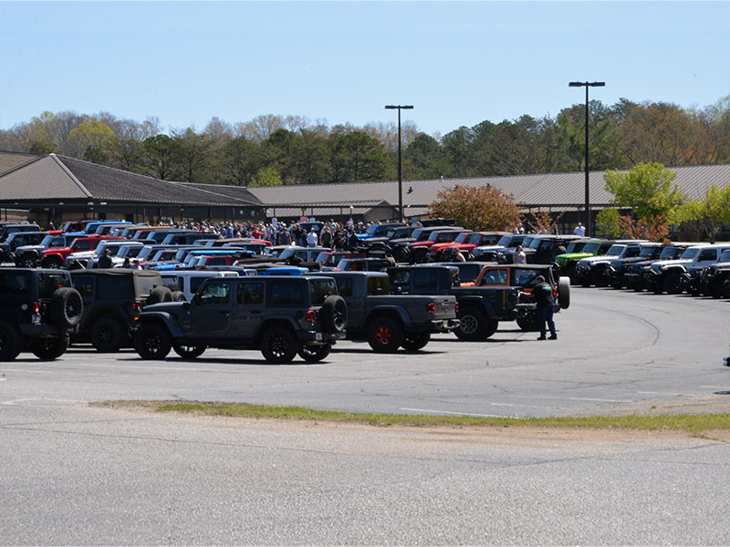 Jeeps and people filled the parking lot at Fannin County Middle School on a sunny morning Saturday for Ride the Ridge to benefit Shop With A Cop.