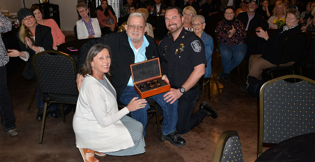 City Clerk Nancy Godfrey and Police Chief Michael Earley presented Thomas Seabolt something he never needed during his years as mayor, a gavel.