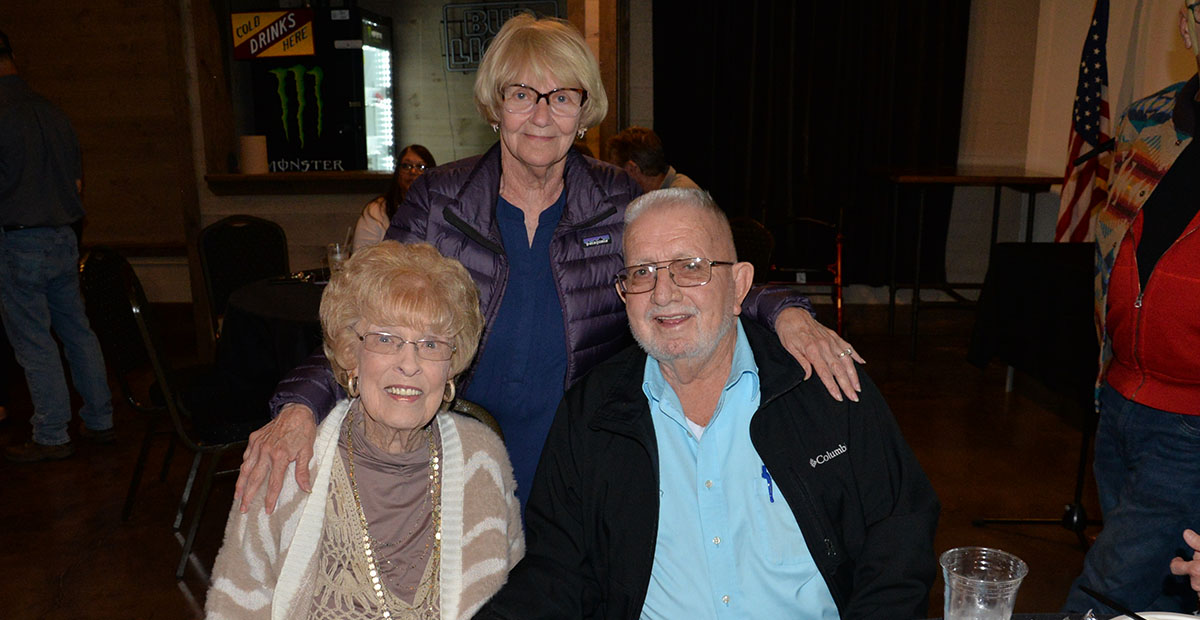 Ann Williams, standing, and Sue Beaver shared memories with Thomas Seabolt during a celebration of his years in office at Tooneys in McCaysville. Seabolt was first elected in 2011 and had just been re-elected to begin a fourth term in January 2024. Health reasons have forced his resignation.