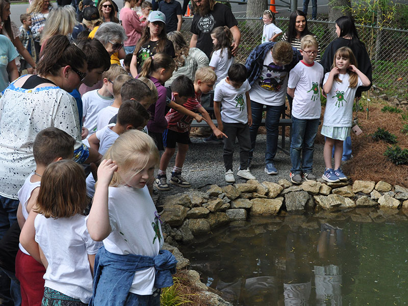  The kids of West Fannin gathered around the Frog Bog pond to look for the frogs.