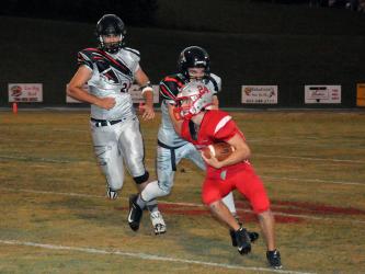 Copper Basin’s Chase Mickens looks for yardage against the North Georgia Falcons.