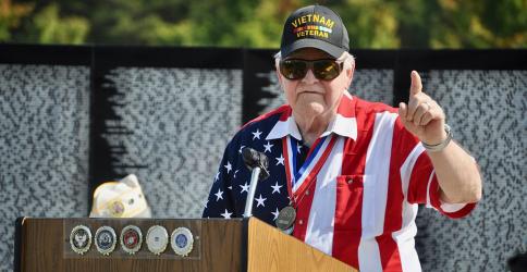 Vietnam War veteran George Nelson explains some of the history of the war to the crowd gathered for The Vietnam Traveling Memorial Wall memorial service Friday, October 4. The wall was on display in Blue Ridge from October 3 to 7.