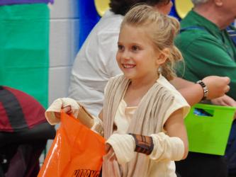 East Fannin Elementary School student Emmalynn Smisson trick-or-treats as Rey from Star Wars during the school’s Halloween event Thursday, October 31.