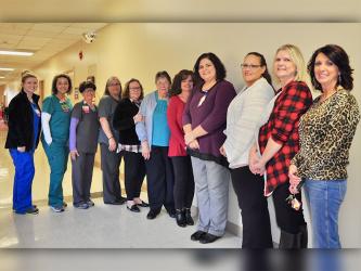 Fannin Regional Hospital Billing Specialist Mary Gage celebrated 43 years of service with her co-workers and friends during her retirement reception Friday, November 1. Shown are, from left, Holly Lowry, Tosha Brookshire, Cindy McDougal, Angie Herring, Judy Little, Gage, Karen VanZandt, Melissa Eaton, Cindy Watkins, Melissa Barker and Lisa Grindstaff.