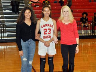Copper Basin High School celebrated eleven basketball and cheerleading seniors in between games Tuesday, February 18. Brackett is shown with her sister, Ashleigh Brackett, and her mother, Amber Martin.