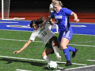 Lady Rebel Sarah Sosebee fights for the ball in recent action for the Fannin County Lady Rebels soccer team.