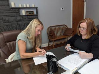 Habitat for Humanity of Fannin and Gilmer counties’ most recent home build recipient Kristen Haley, left, officially became a homeowner Saturday, September 30. She is shown beside Attorney Laura J. Ray.