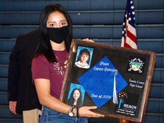 Fannin County High School Freshman Brisa Lopez-Garcia displays her Realizing Educational Achievement Can Happen (REACH) shadow box during the Signing Ceremony.