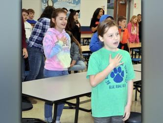 4-H Project Achievement Awards were presented to Blue Ridge Elementary School fourth and fifth grade students Tuesday, March 23. Shown performing the 4-H Pledge are, from left, Olivia Hill and Lynnex Patterson.