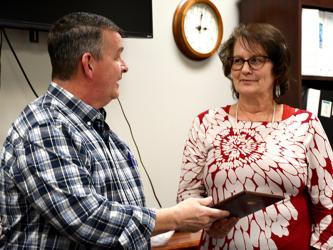 Fannin County Board of Commissioners’ Chairman Jamie Hensley presented Chief Land Development Officer Marie Woody with a plaque honoring her 40 years of the service to the county Tuesday, March 9.
