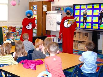 West Fannin Elementary School Pre-K students excitedly listen as Thing 1 and Thing 2, also known as Principal Alison Danner and Assistant Principal Milly Rice, act out and read a Dr. Seuss story for Read Across America Week Tuesday, March 2.