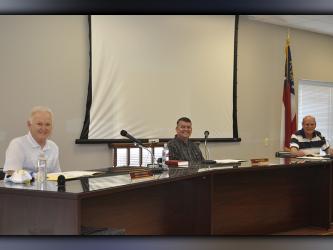 All together in person for the first time since Jamie Hensley and Johnny Scearce were elected in November, the Fannin County Board of Commissioners met in regular session Tuesday, May 18. Shown are, from left, Post One Commissioner Scearce, Chairman Hensley and Post Two Commissioner Glenn Patterson who began the third year of his term.