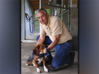 This male Beagle was surrendered Thursday, June 24. He has a black, brown and white coat with cute, floppy ears. View this sweetie using intake number 206-21. He is shown with animal control Interim Manager J.R. Cornett.