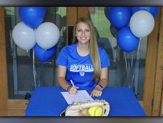 Allie Ballew smiles as she recently signed a scholarship to further her academic and athletic career playing softball at Tennessee Wesleyan University.