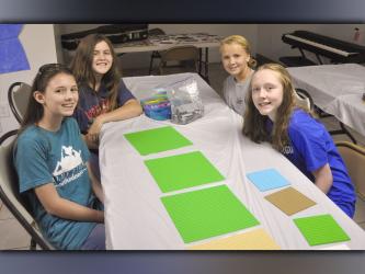 The middle-school-aged group spent a portion of their time building with legos during the McCaysville Gospel Tabernacle’s Vacation Bible School Tuesday, July 13. Shown are, from left, Emily Dickey, Natalie Reeves, Kenslee McClure and Emma Buchanan.
