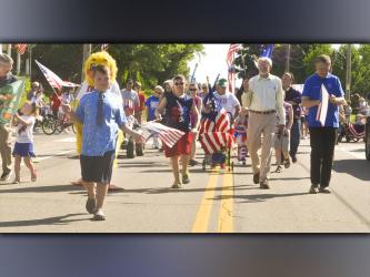 Ducktown Mayor for the day Izaiah Bradburn, left, leads the Patriotic Walking Parade to kick off the festivities Saturday, June 26, at the 46th Annual Miner’s Homecoming.