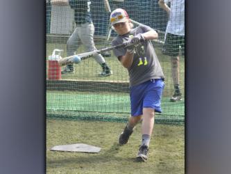 Cauy Sutton makes contact with a ball during Fannin County High School baseball’s hitting camp Wednesday, July 14.