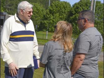 Saint Anthony’s Catholic Church Deacon Loris Sinanian talks with two individuals participating in HER HOPE Pregnancy Center’s Walk for Life fundraiser Saturday, June 26.
