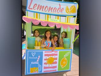Sloane Sanchez, Olivia Sanchez, Lucy Sanchez and Emilia Eckles, from left, recently raised $200 to donate to St. Jude’s Children’s Hospital by serving lemonade off Mark and Nancy Staley’s, Eckles’ grandparents, boat dock in Morganton. “The girls’ mothers used the experience as a teaching moment about charity and what it means to help others,” Staley said.