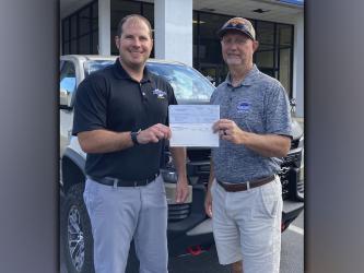 Bill Holt Chevrolet partnered with Chevy Youth Baseball and Softball and donated $1,000, as well as extra equipment, to the Fannin County Recreation Deptarment baseball and softball programs. Bill Holt employee Dewey Cardd is shown giving a check to Fannin recreation department Director Eddie O’Neal.