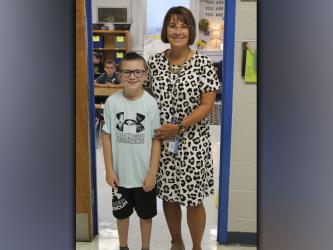 East Fannin Elementary student Zander Sparks, left, smiles on his first day of third grade with his new teacher, Lori Robinson.