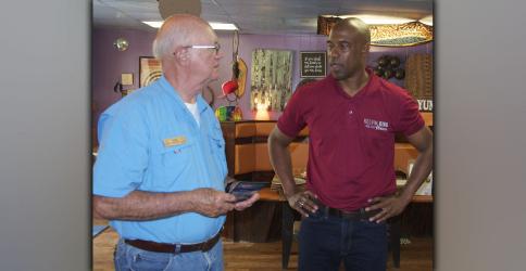 Kelvin King, right, who is challenging Senator Raphael Warnock in next year’s election, made a stop at Mystic Mountain Pizza in Blue Ridge Saturday, August 14, and is shown talking about his campaign with John Jenkins.