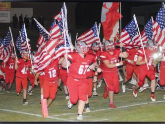 The Copper Basin Cougar football team recently had a patriotic entrance to their football game. Shown with American flags are, from left, (14) Tucker Rhodes, (42) Carder Lance, (12) Sebastian  Baliles, (67) Tucker Shroth, (61) Addison Hook and (6) Eli White.