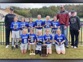 The Fannin County Lady Rebel flag football team won the first ever Super Bowl Saturday, October 30, against Lumpkin County. Shown following the win are, from left, front, McKinley Sandefur, Ryann King, Khloe Kay, Selah Patterson and Braylee Davenport; back, assistant coach Grant Fitts, Lynnex Patterson, Bristol Falls, Bailee Rhodes, Gracelyn Gray, Hadlee Patterson, Kayden-Leigh McClure, head coach Seth McClure and assistant coach Kristin Kay. Not pictured Violet Miller.