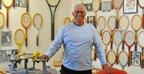 Standing inside his vintage tennis museum, Mountain Tennis, Mel Locklear enjoys spending his retirement time not only educating the community about the history and game of tennis, but also volunteering his time giving free tennis lessons to local area kids in the Blue Ridge City Park Monday through Thursday afternoons, 50 weeks out of the year. 