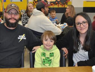 First grader Carter Pickard, middle, and his parents, Dillion and Stephanie Pickard, enjoyed having Thanksgiving lunch together at West Fannin Elementary School Thursday, November 18. 